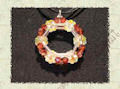 ciondolo con fiori swarovski e tubini rocaille