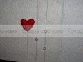 Album con carta effetto pizzo, cuori in feltro e perle - particolare.